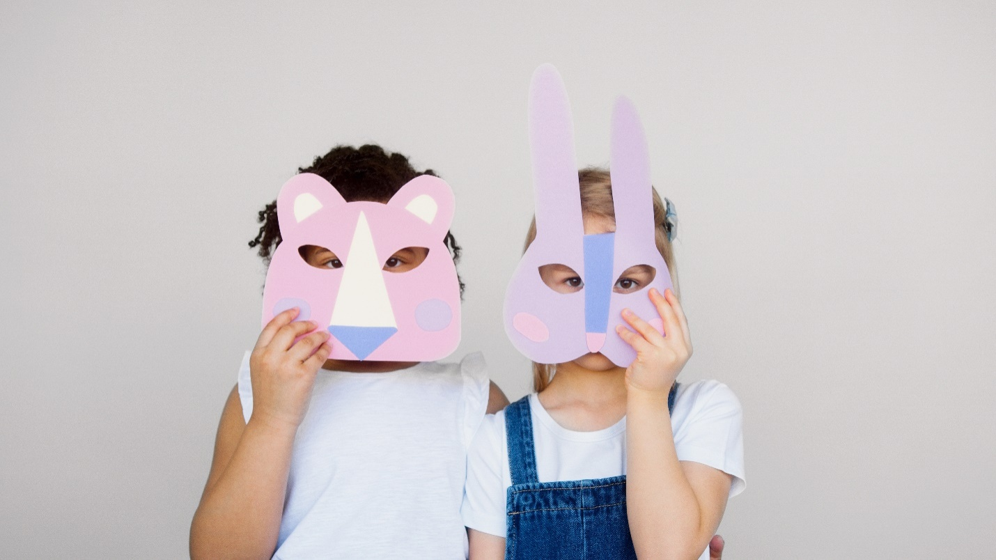 children wearing crafted animal masks